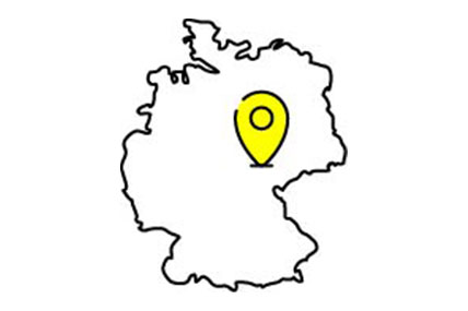 Umrisse von Deutschland mit gelbem Pin, symbolisiert die Produktion in Deutschland